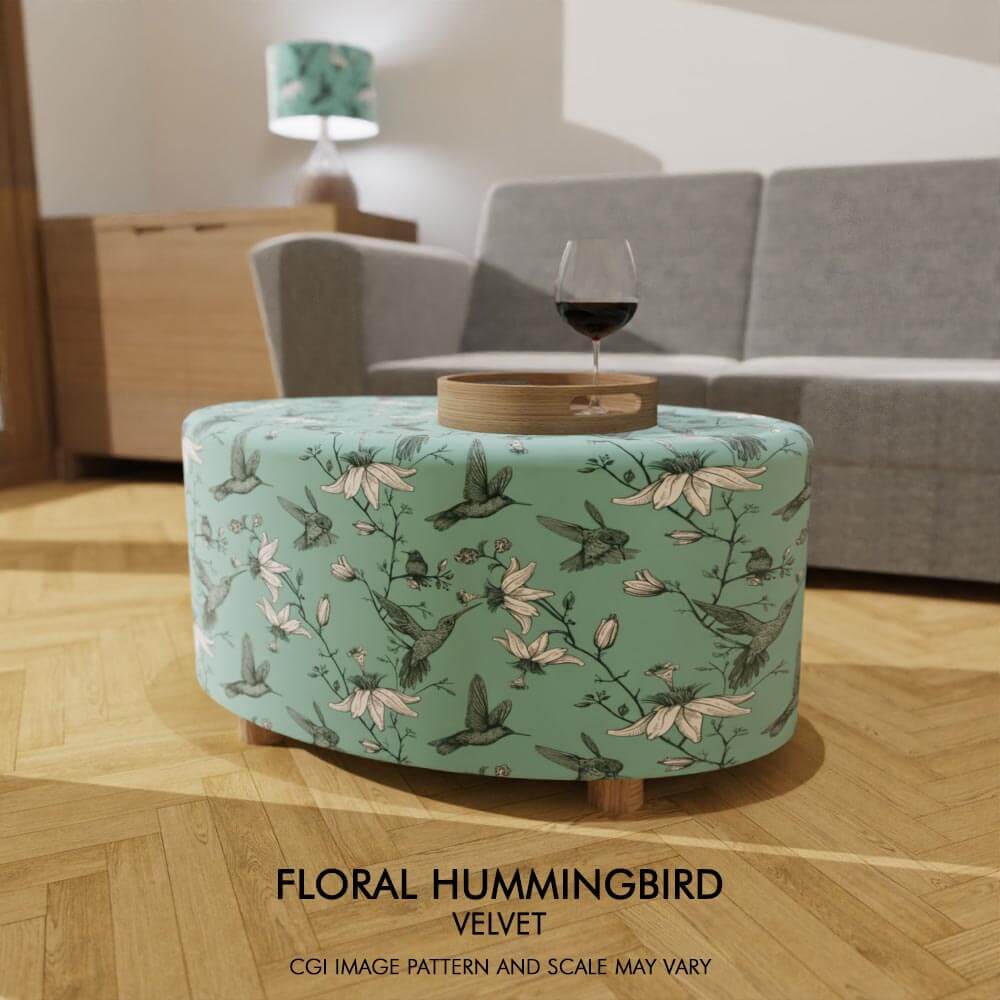 Oval coffee table footstool adorned in soft velvet featuring Floral Hummingbird design, infusing the room with delicate beauty and graceful charm