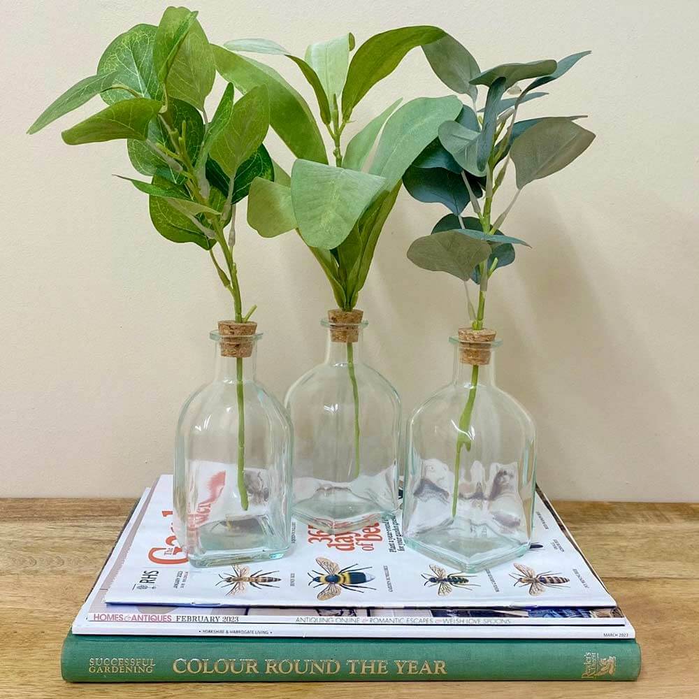 Three Artificial Leaves In Vases